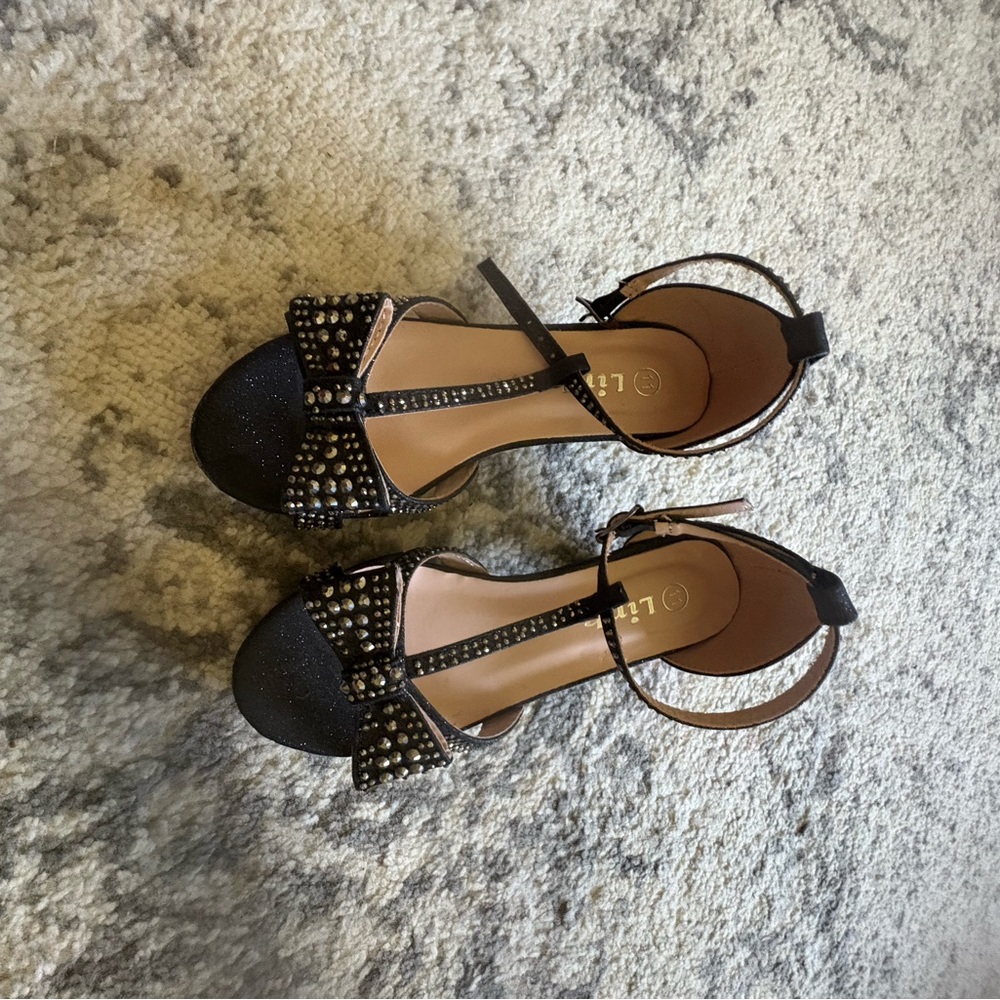 Size 11 young girls heels with gems. Worn a few times. Has some flaws seen photo